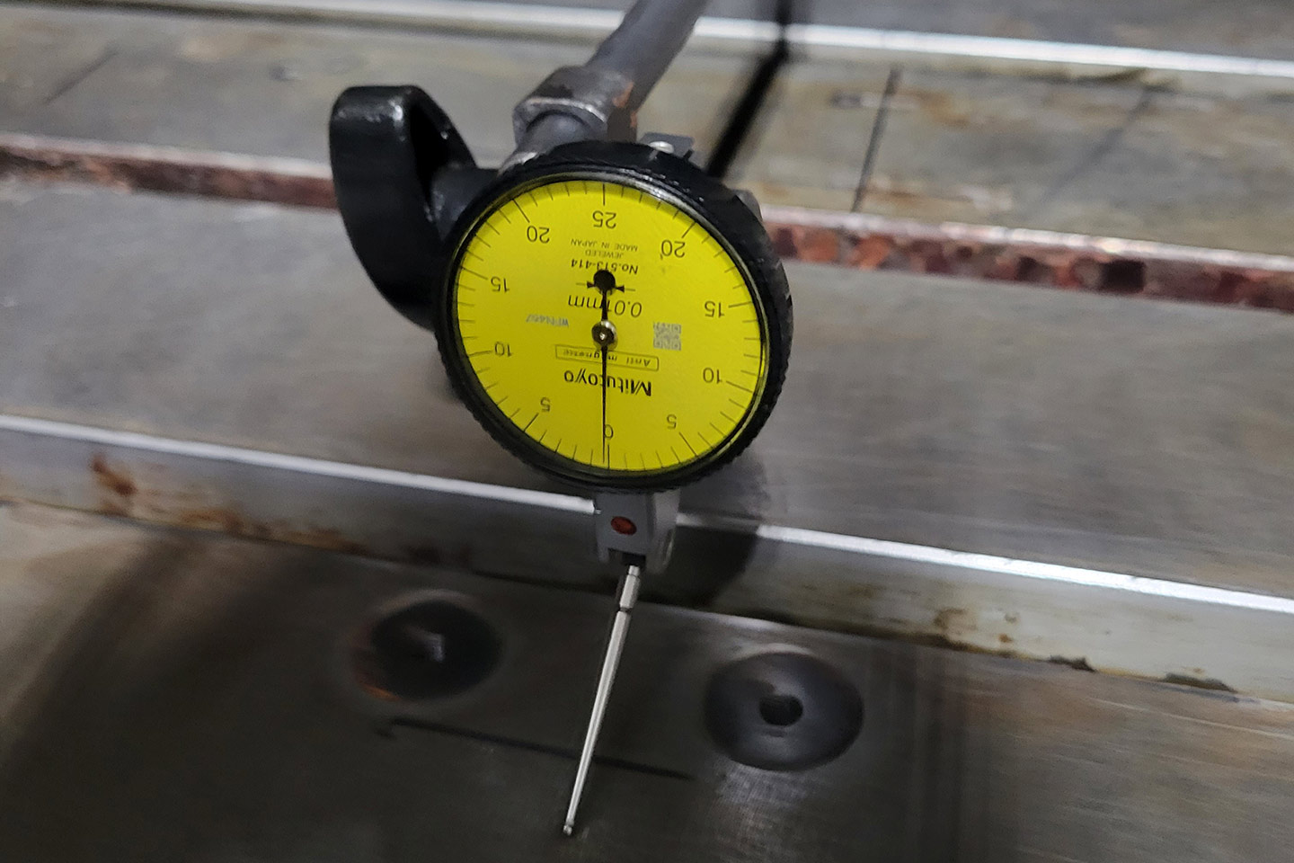 gauge being used to monitor a machine component