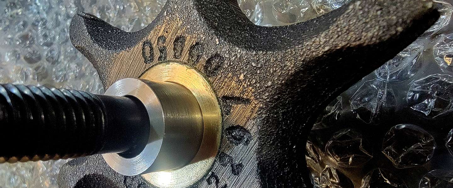 close up view of a tool working on a machine component